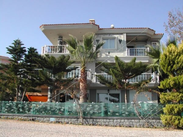 Eccentric Millionaire Builds Aquarium Fence Around His Mansion